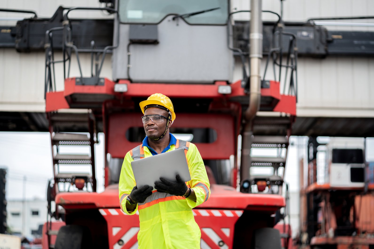 Worker in Protective Uniform in Workplace 