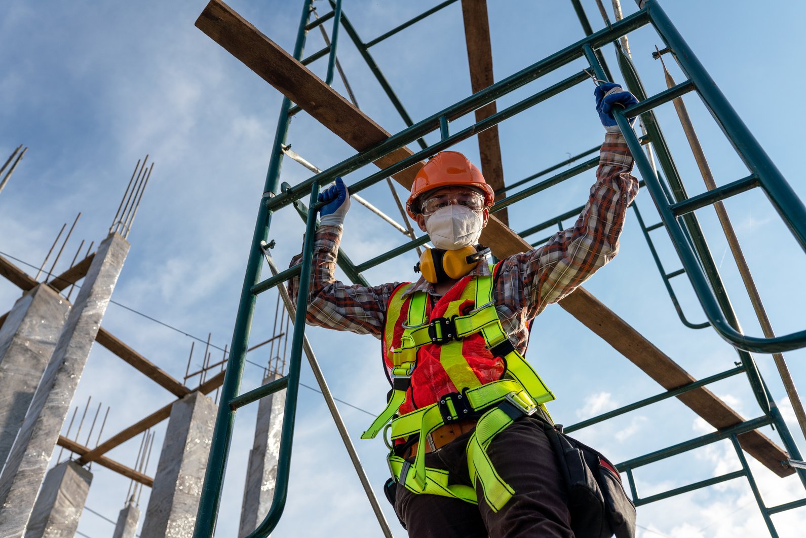 Worker Wearing Safety Uniforms Working at Height